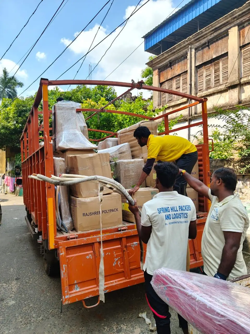 Goods loaded onto a Spring Hill tempo