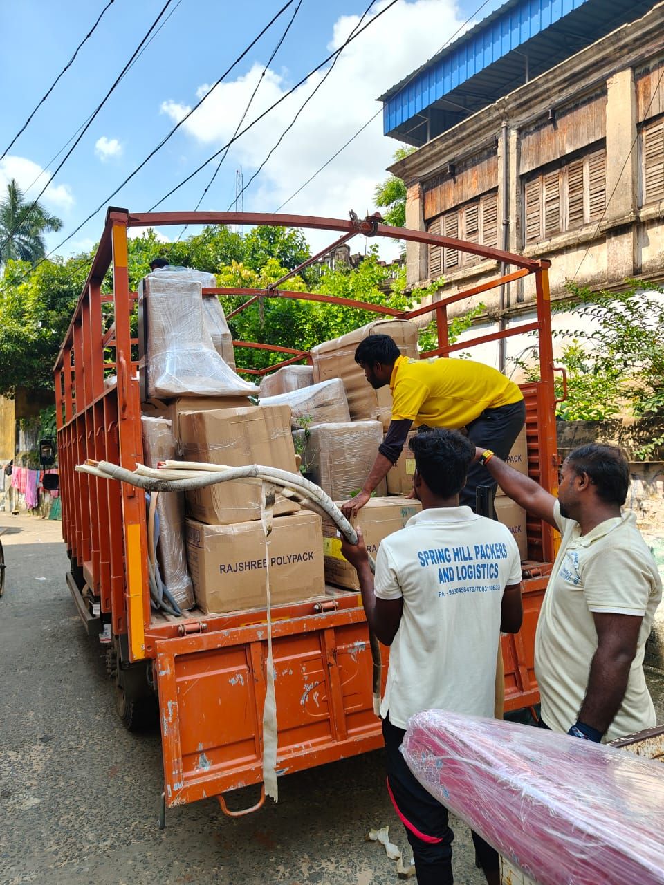Goods loaded onto a Spring Hill tempo